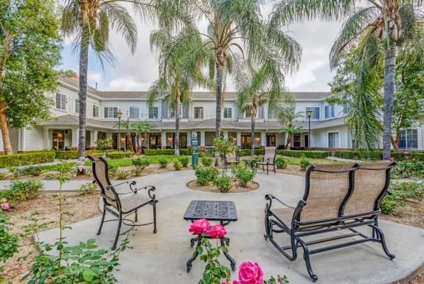 Beautiful outdoor garden area with seating and flowers