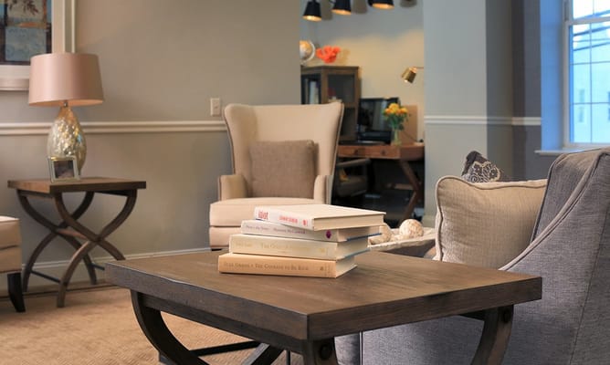 Comfortable seating area with books in a common room