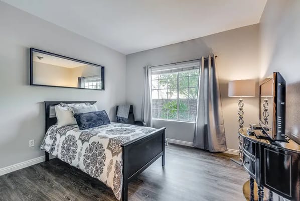 Cozy interior of a resident bedroom with natural light