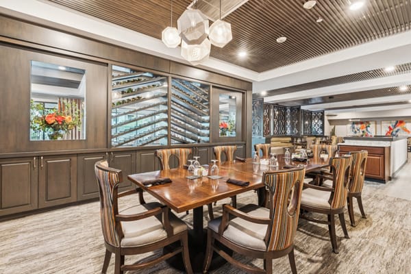 Elegant dining area with a large wooden table and modern decor