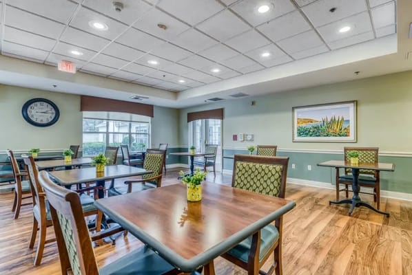 Interior view of a dining area with tables and chairs