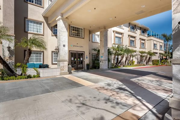Front entrance of a senior living facility with outdoor space