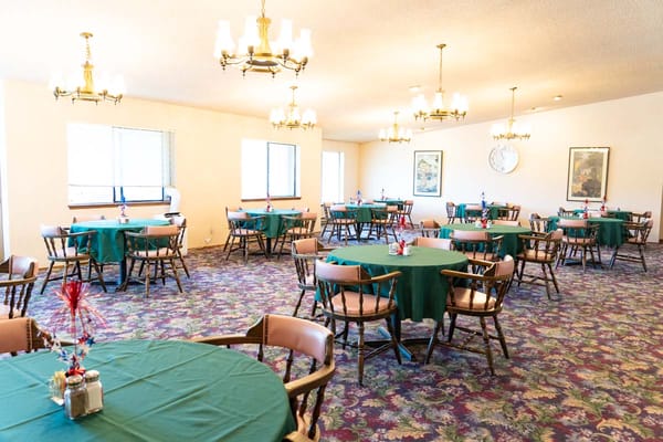 Interior dining room setup with tables and chairs