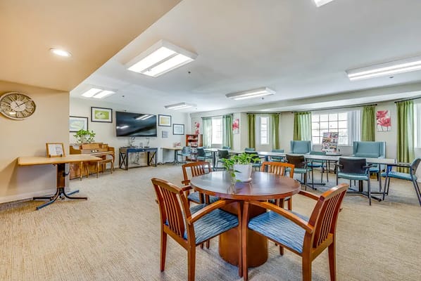 Bright common area with seating and natural light