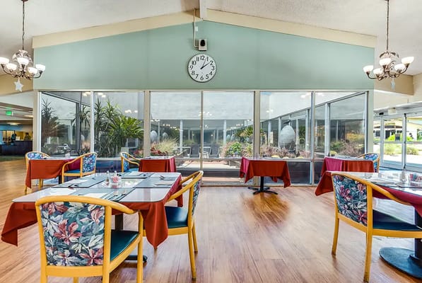 Dining room with tables and views of outdoor garden