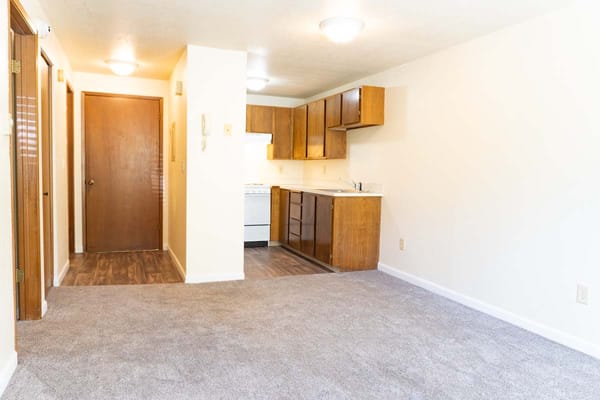Interior view of a small apartment unit with kitchen