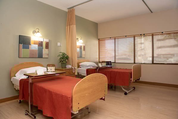 Private resident rooms with beds and decorations