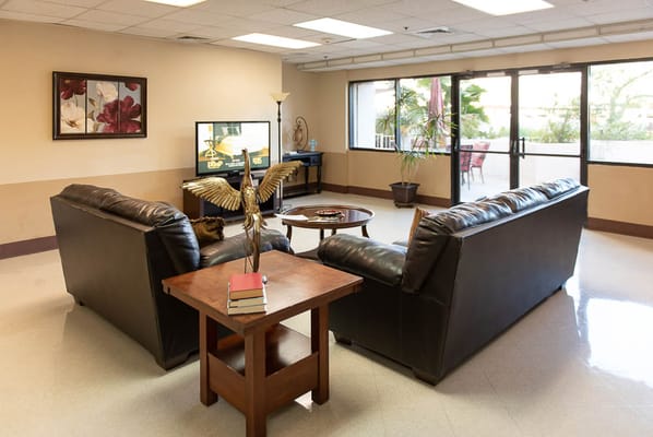 Cozy common area with seating and large windows