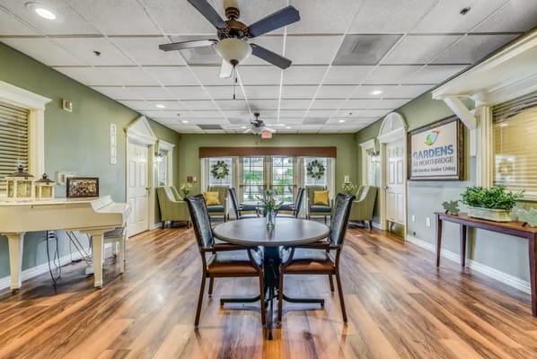 Bright common area with seating and piano