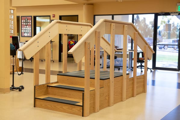 Therapy stairs in a spacious facility interior
