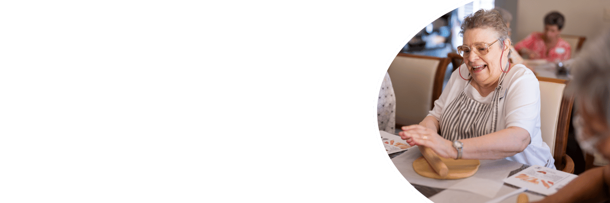 Residents participating in a creative activity indoors