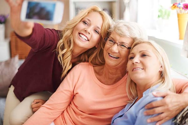 Three women enjoying a joyful moment together