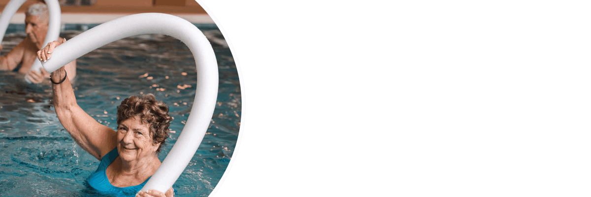 Residents participating in a water aerobics class