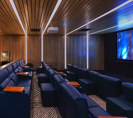 Interior view of a theater with reclining seats