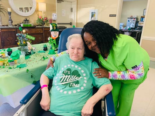Resident and staff member celebrating an occasion together
