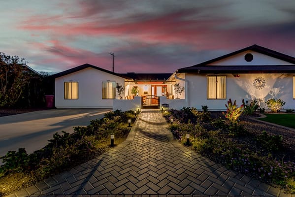 Pathway leading to a senior care facility at dusk