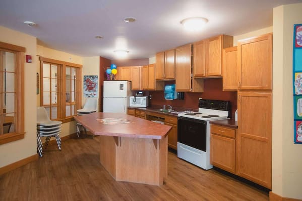 Interior kitchen area with appliances and cabinets