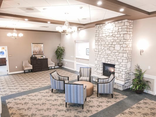 Interior common area with seating and fireplace