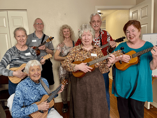 Residents participating in a ukulele music activity