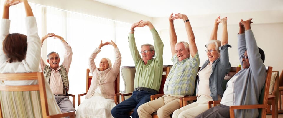 Residents participating in a group exercise activity