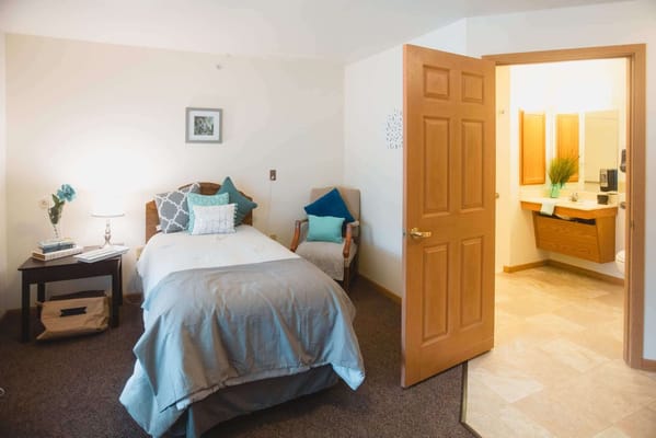 Cozy resident room with a bed and bathroom