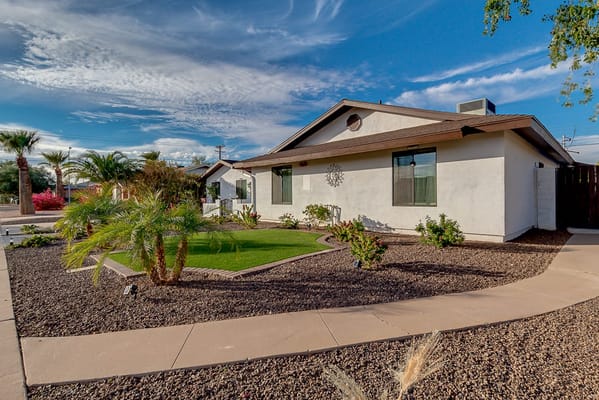 Exterior view of a nursing home with landscaped garden