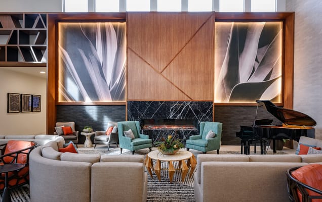 A comfortable lobby area with seating and piano