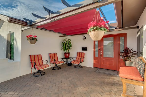 Outdoor seating area with colorful plants and flowers