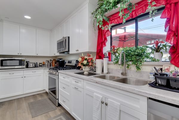 Bright and clean kitchen space with plants and decor
