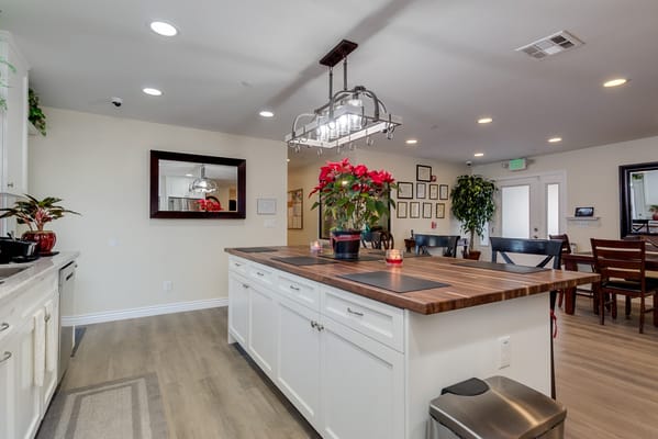 Interior view of a common area with a kitchen island