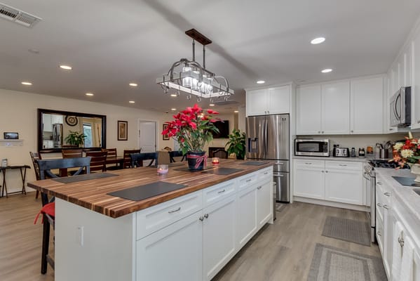 Modern kitchen area with dining space and plants