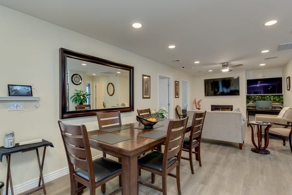 Interior view of a common area with dining table and seating