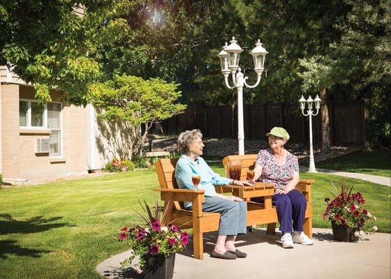 Residents enjoying time together in a garden setting