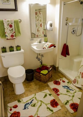Brightly decorated bathroom with floral accents