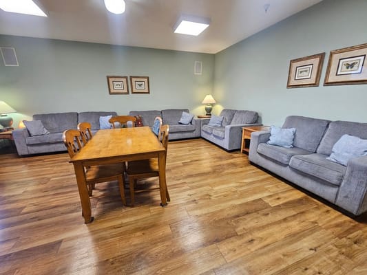 Common area with couches and a dining table
