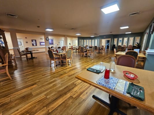 Dining area with tables and chairs in the facility