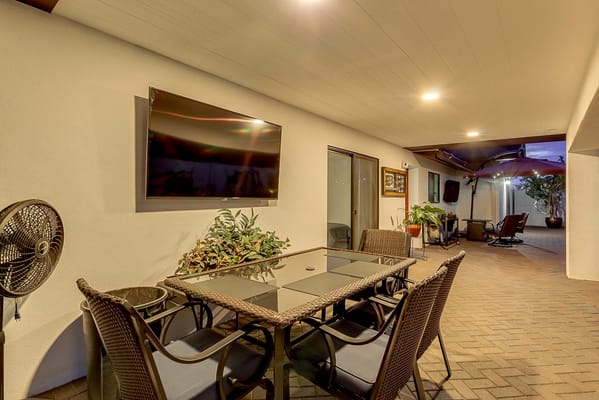 Outdoor patio dining area with table and chairs