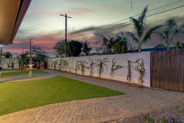 Well-maintained outdoor space with grass and garden features