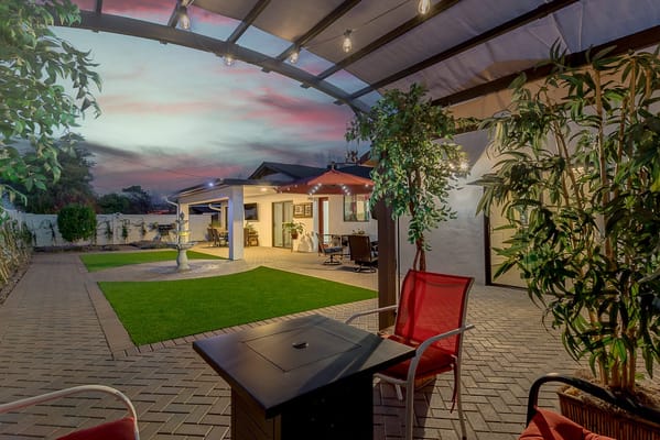 Outdoor patio area with seating and garden