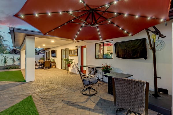 Outdoor seating area with an umbrella and patio