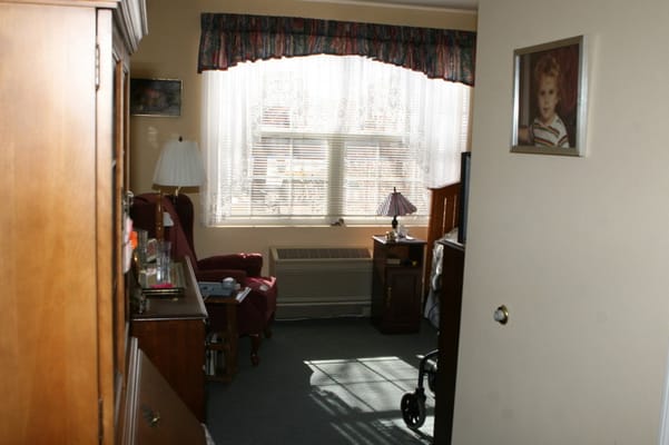 A cozy resident room with natural light