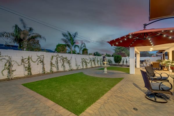 Outdoor space with a lawn and seating area