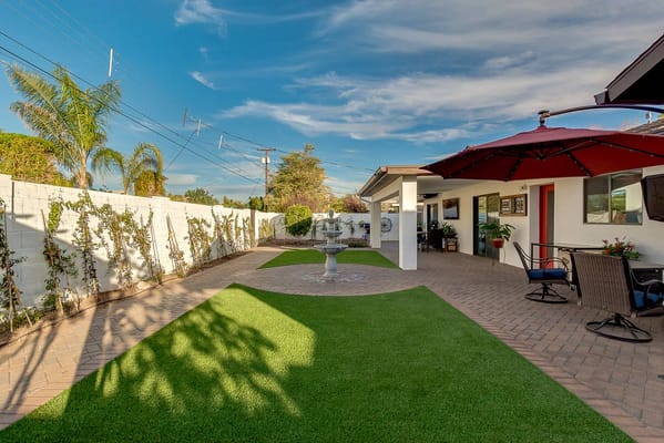 Outdoor space with a seating area and landscaping