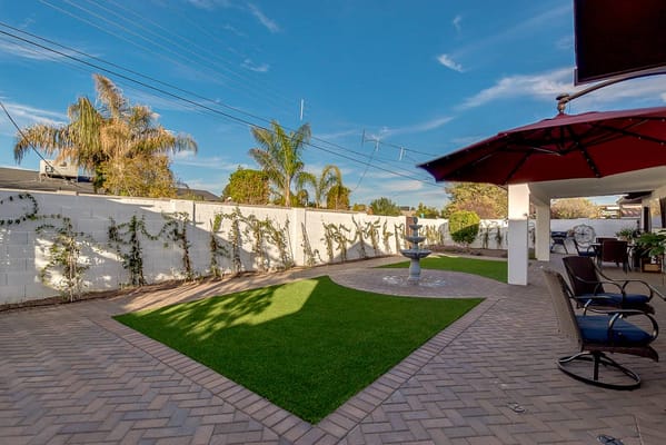 Well-maintained outdoor space with seating and landscaping