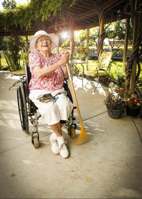 Resident enjoying gardening in an outdoor space