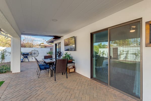 Outdoor living space with seating and plant decor