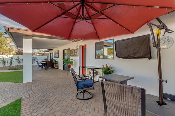 Outdoor patio with seating and umbrellas