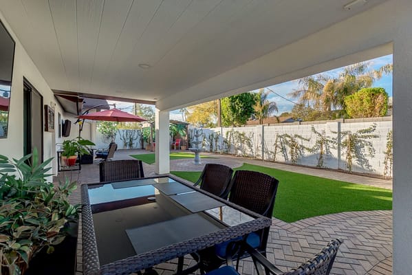 Outdoor seating area with furniture and greenery