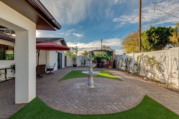 Outdoor space with a fountain and seating area