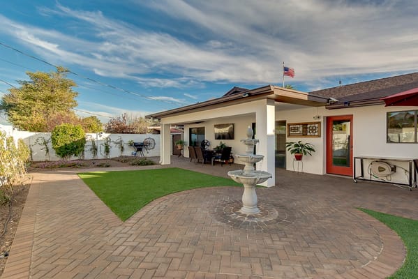 Outdoor courtyard with a fountain and seating area